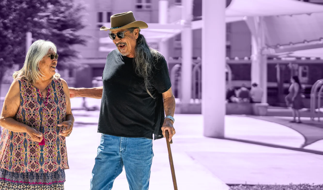 Man and woman talking during a walk through Civic Plaza
