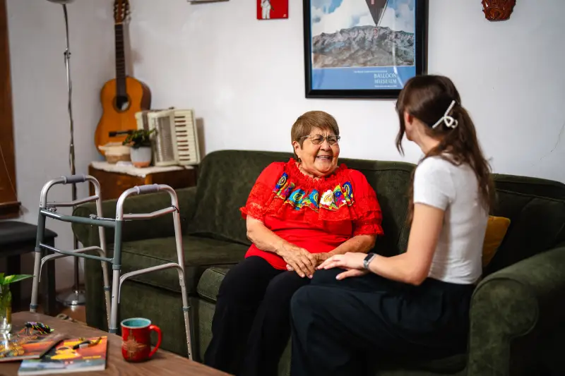 Granddaughter speaking with Grandmother