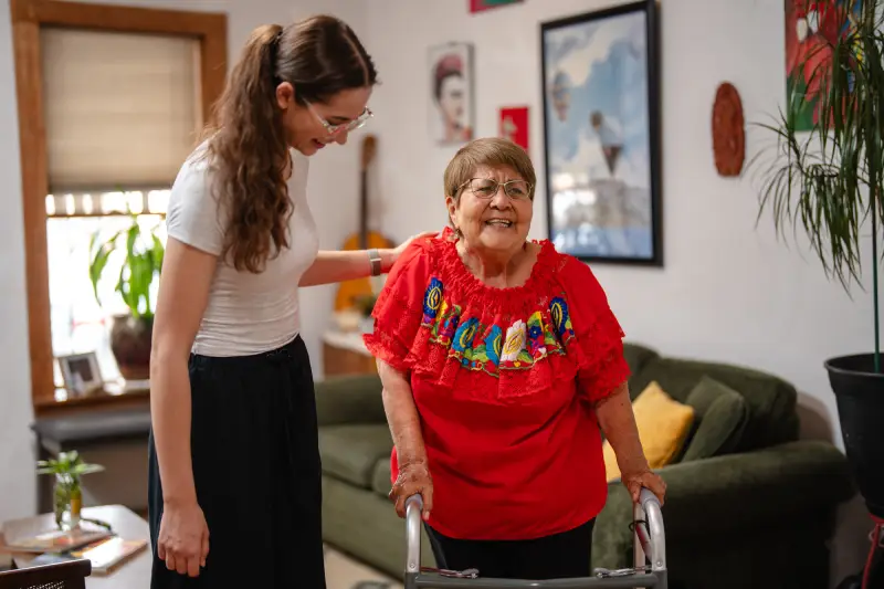 Granddaughter helping her grandmother