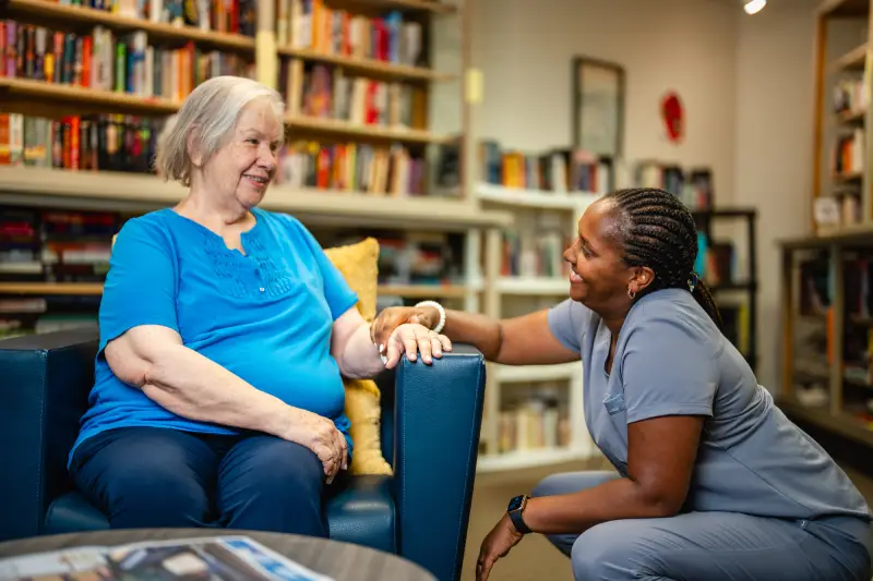 Health Professional speaking with woman