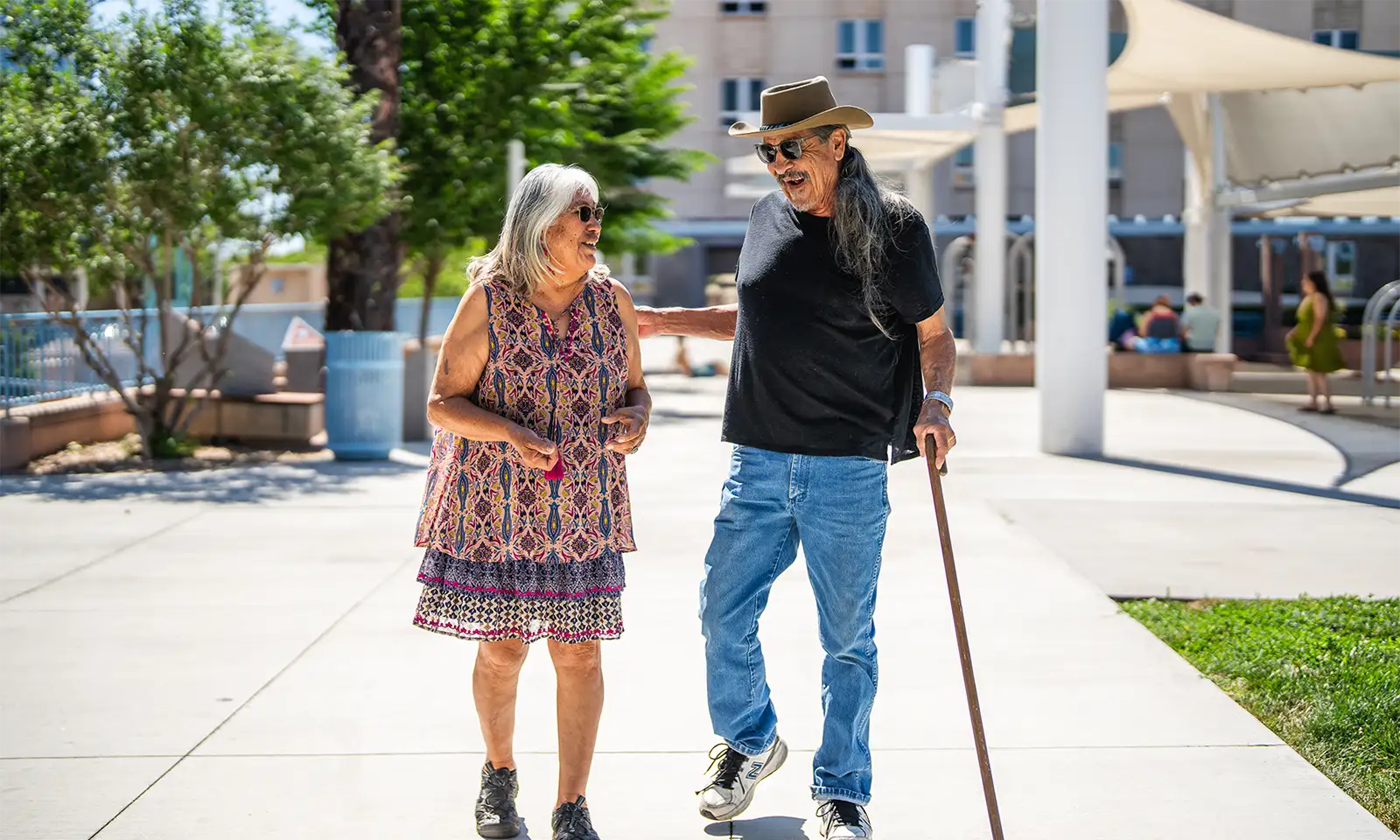 civic-plaza-walk-medium Man and woman talking during a walk through Civic Plaza