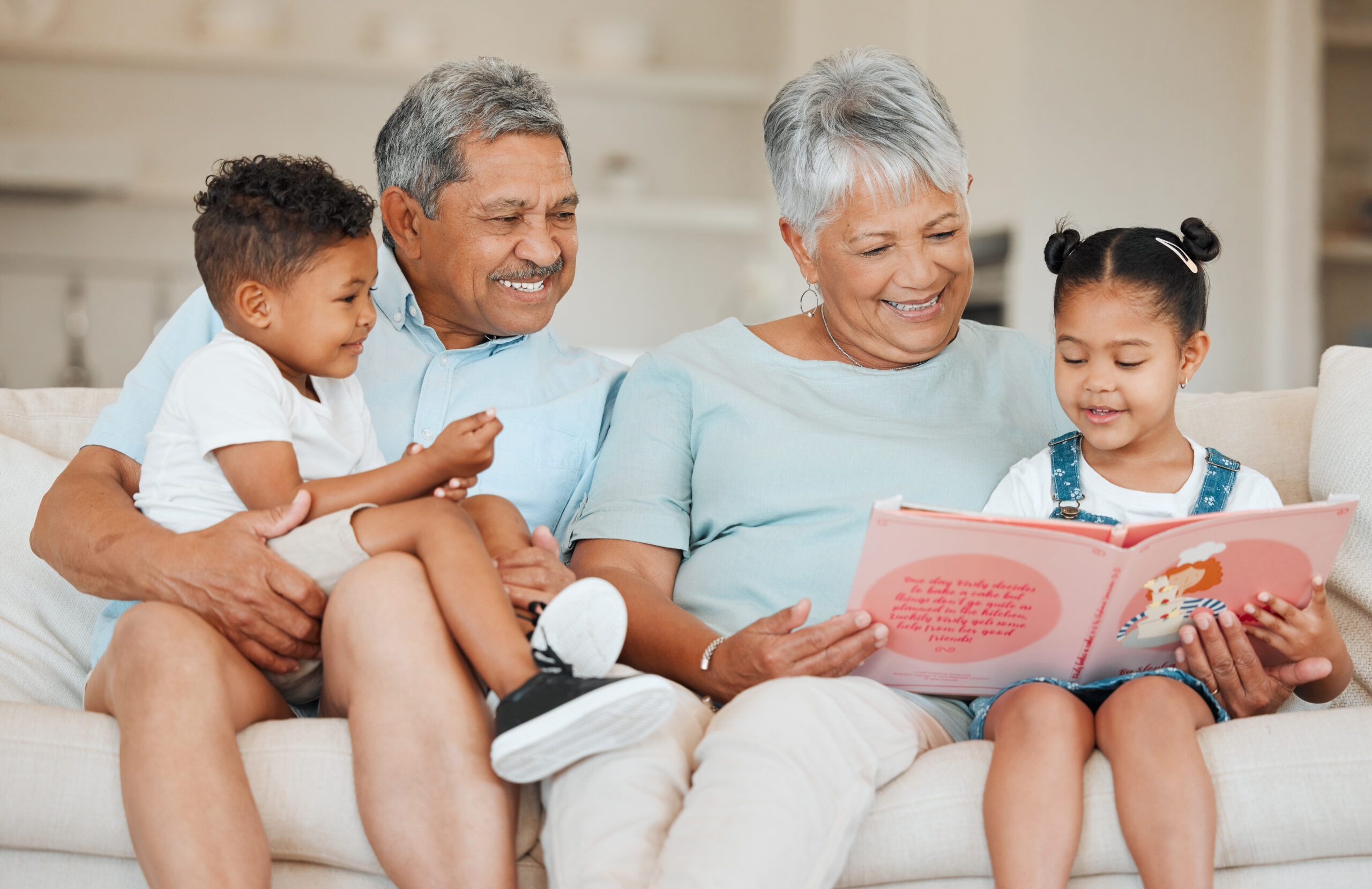 Shot of grandparents bonding with their grandchildren on a sofa at home