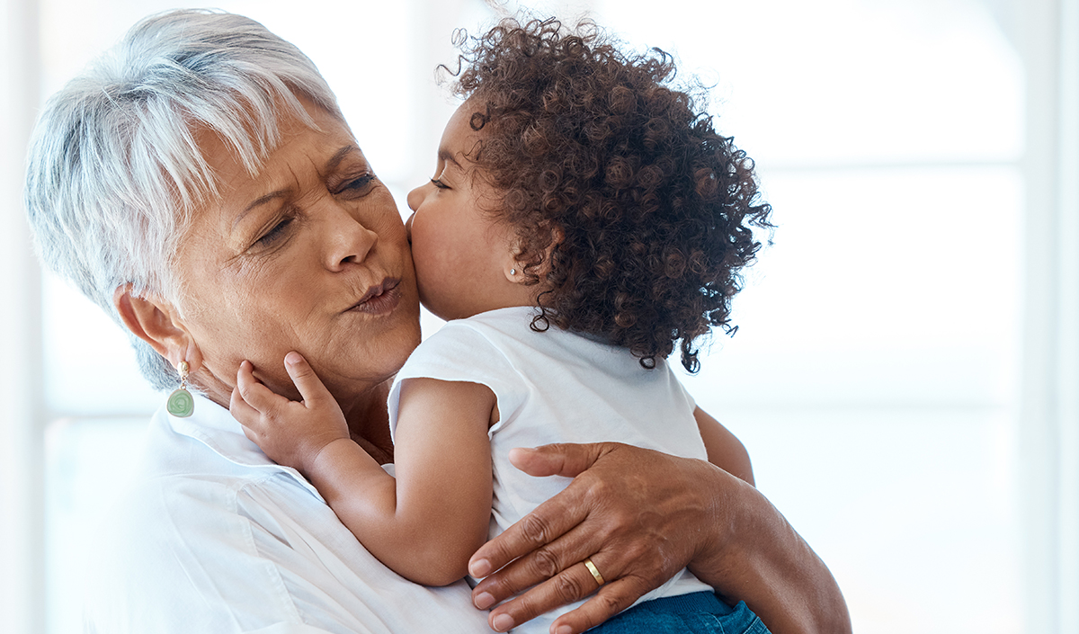  a senior woman spending time with her grandchild at home