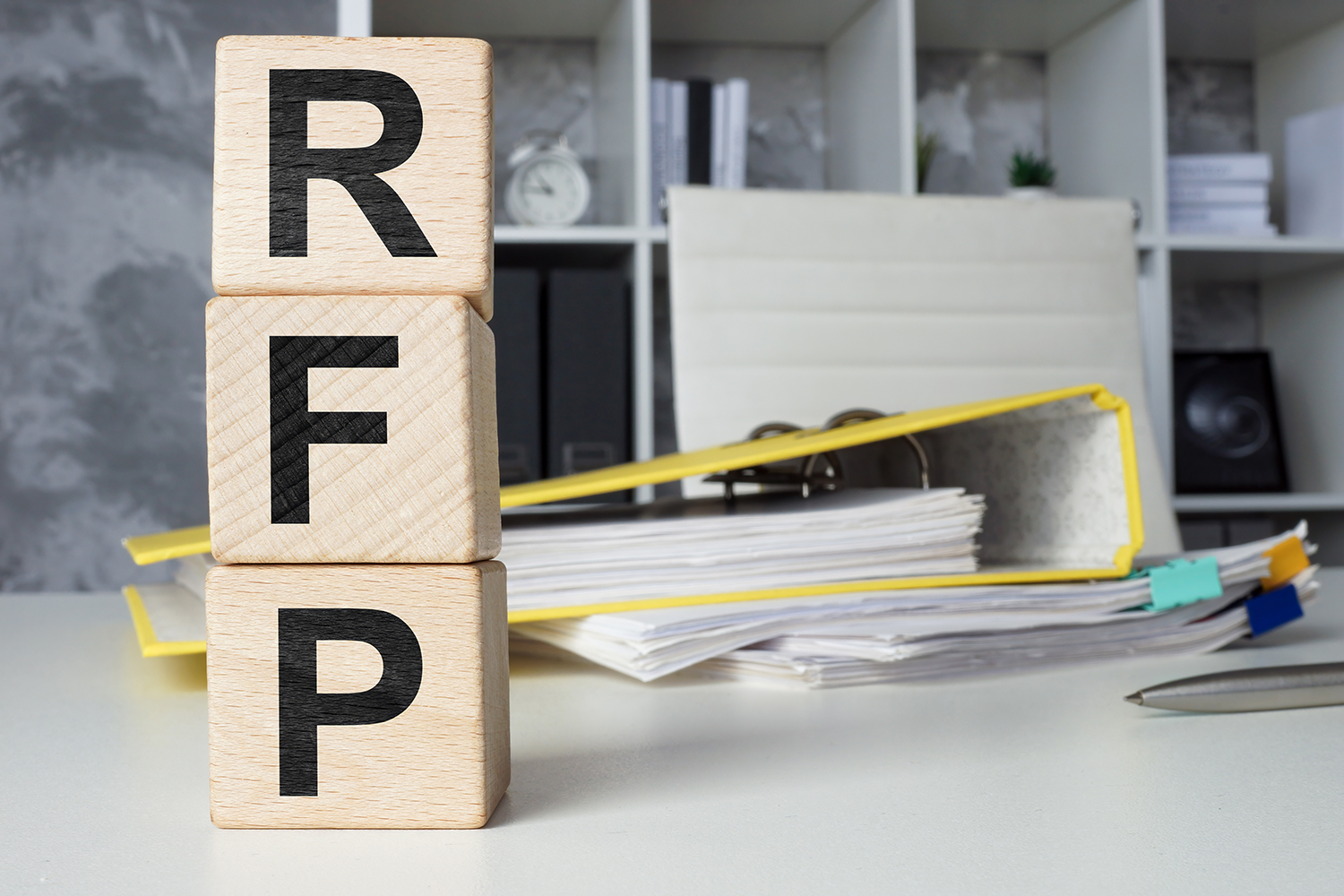 Cubes with letters RFP Request for Proposal in the office.