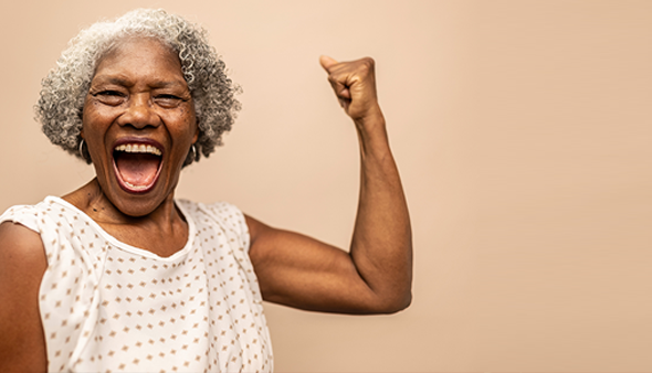 Woman raising are arm in triumph