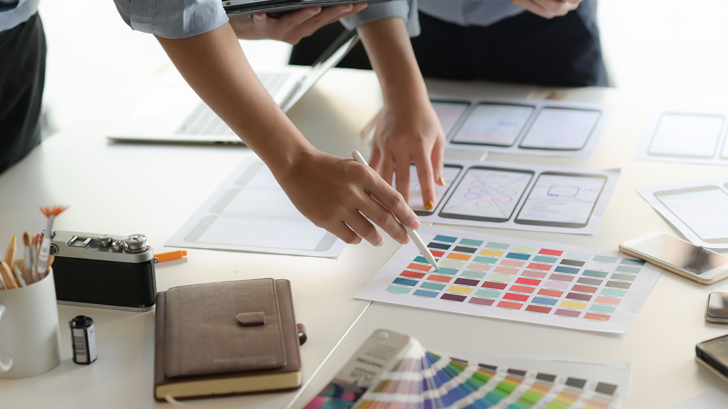Architects examining blueprints in the office