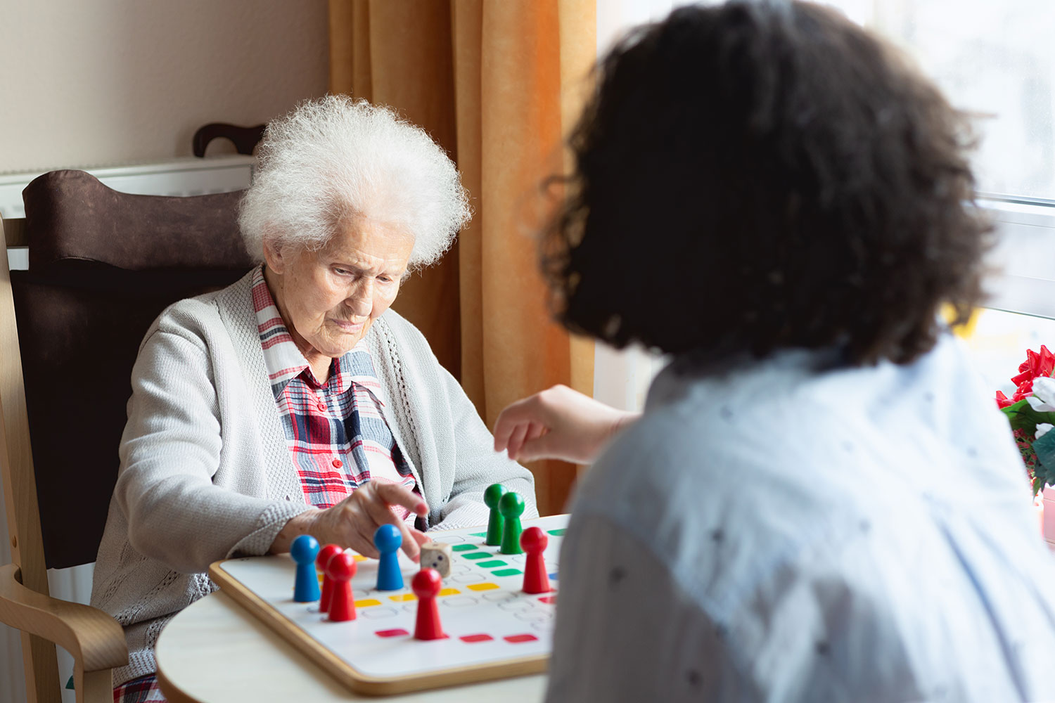 Woman playing an engaging game with a caretaker