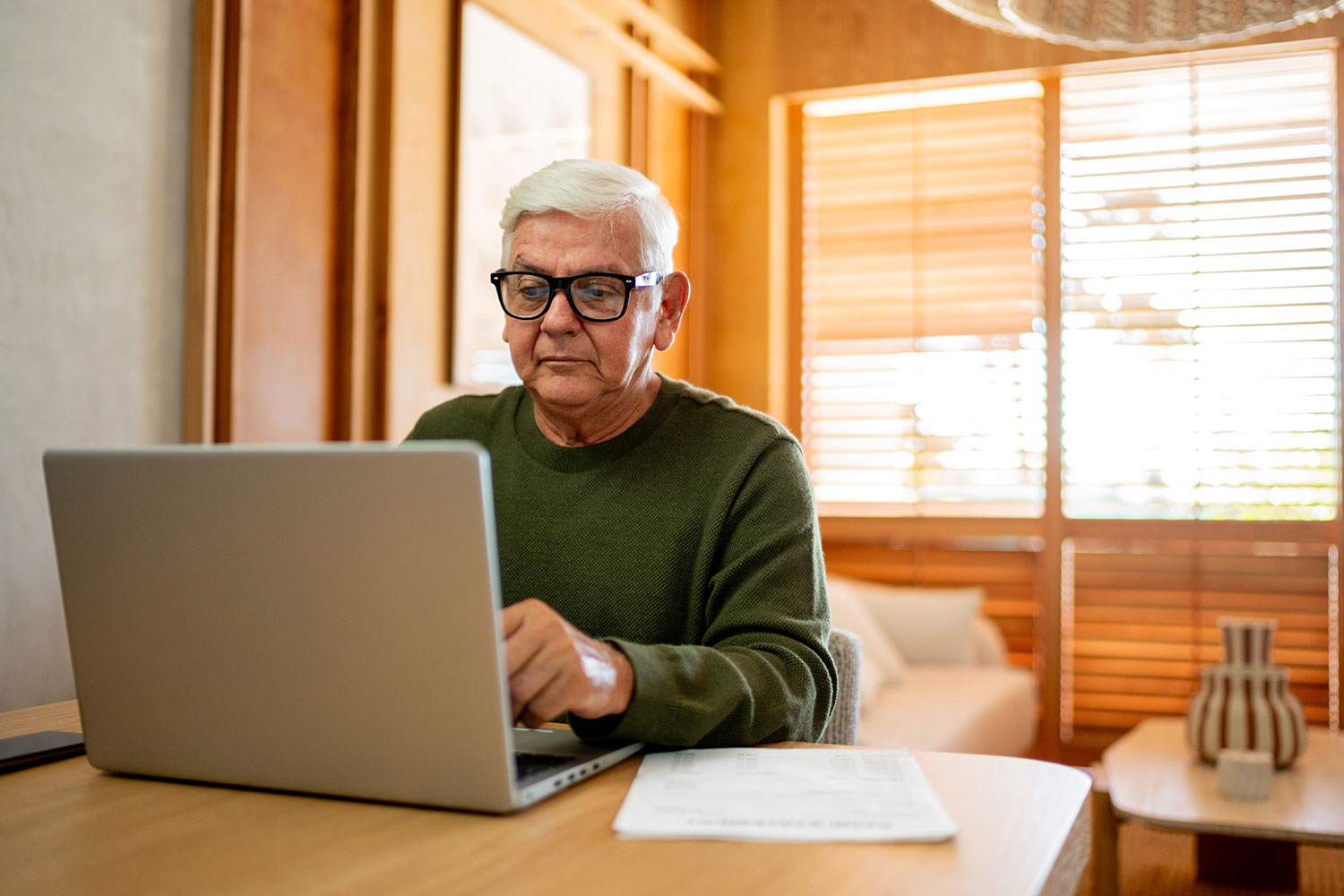 Man looking up resources online.