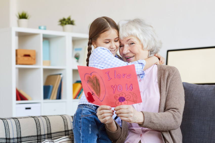 Grandma and her Grand daughter reading a hand made card